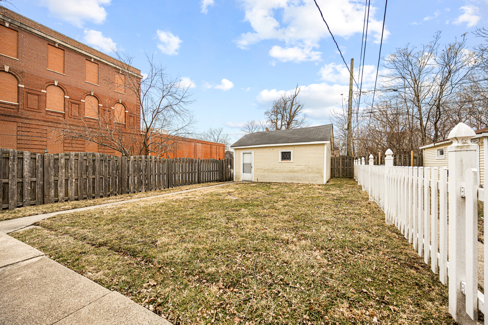 101 West 113th Place Chicago, IL 60628 - Photo 15 of 15 a view of a house with a yard