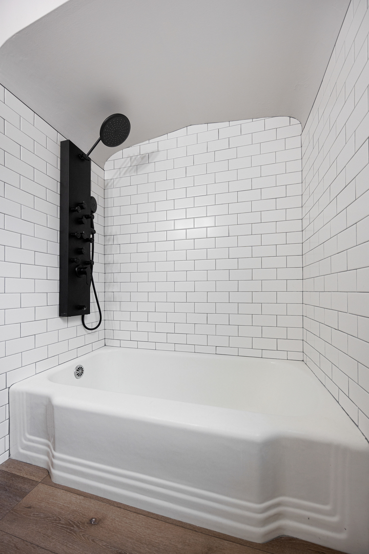 101 West 113th Place Chicago, IL 60628 - Photo 9 of 15 a bathroom with a bathtub and a shower