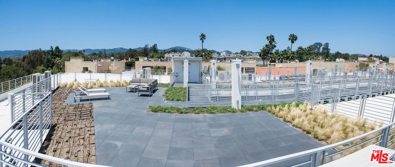 625 South Barrington Avenue, Unit 110 Los Angeles, CA 90049 - Photo 13 of 17 a view of swimming pool from a balcony