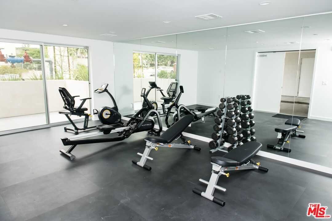 625 South Barrington Avenue, Unit 110 Los Angeles, CA 90049 - Photo 17 of 17 a view of a room with gym equipment