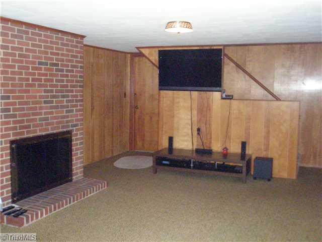 225 Mocks Church Road Advance, NC 27006 - Photo 11 of 12 Den/Family/Great Room. Lower level den with fireplace