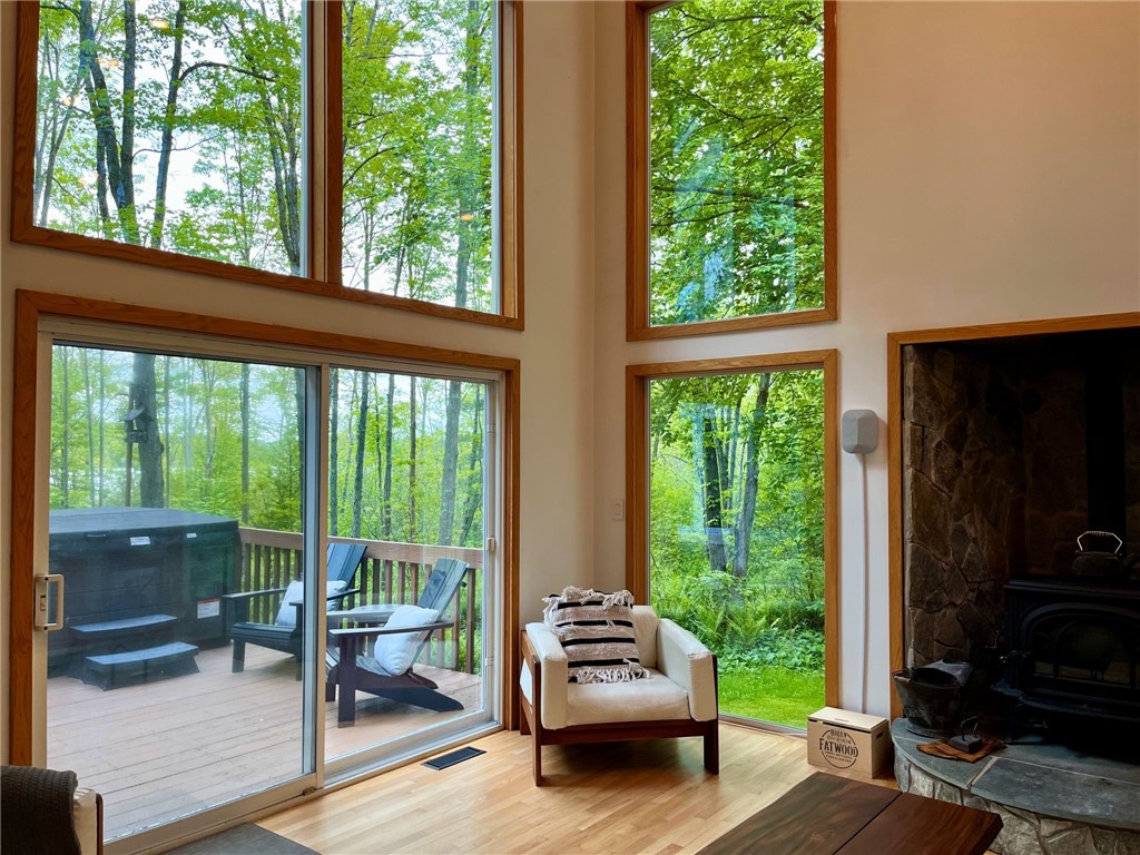 735 Howell Road Conquest, NY 13140 - Photo 21 of 49 Slider to the deck and hot tub from the living roo