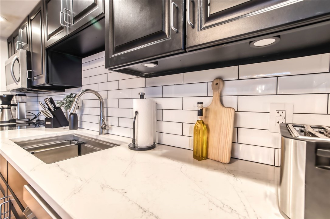 735 Howell Road Conquest, NY 13140 - Photo 29 of 49 New sink/faucet and backsplash added with under co