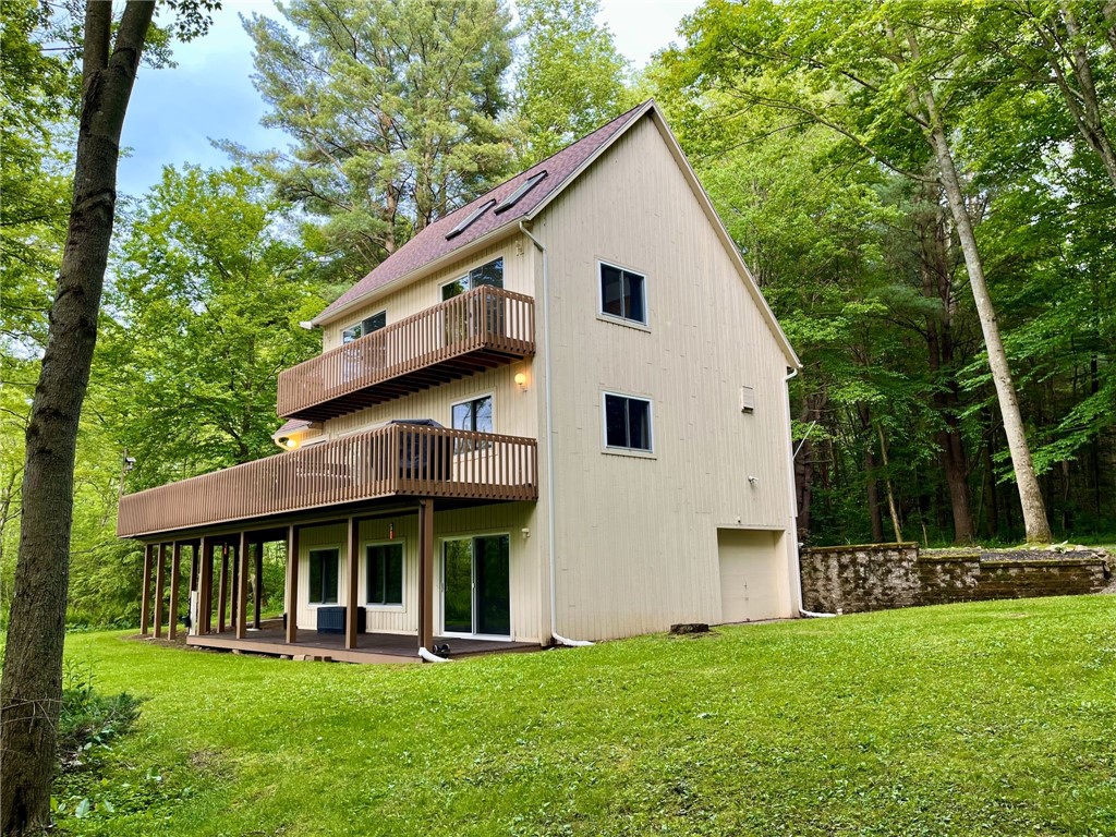 735 Howell Road Conquest, NY 13140 - Photo 3 of 49 Multiple levels to relax and enjoy the views.