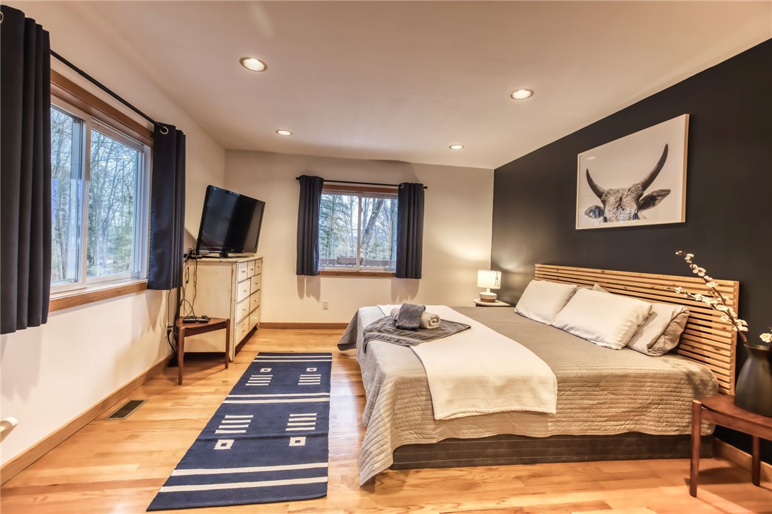 735 Howell Road Conquest, NY 13140 - Photo 34 of 49 First floor primary suite with built-in headboard.