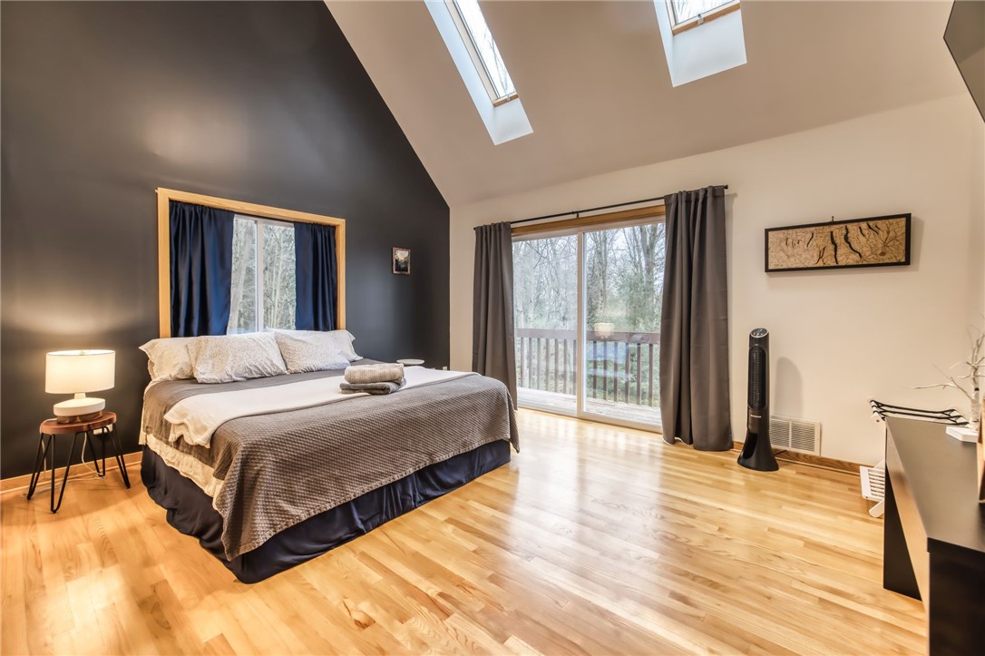 735 Howell Road Conquest, NY 13140 - Photo 42 of 49 Another 2nd floor large bedroom with sliders to th