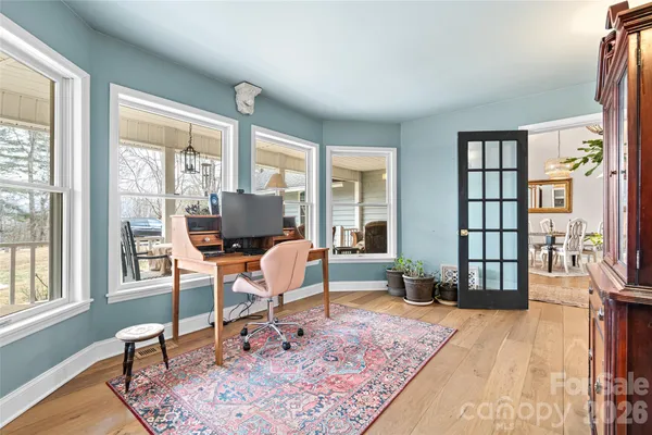a kitchen with cabinets and window