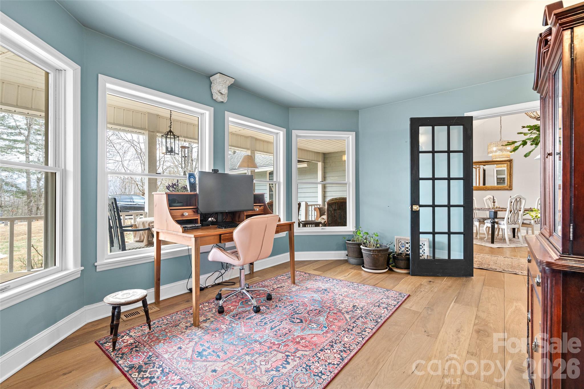 649 Upper Bailey Branch Road Mars Hill, NC 28754 - Photo 12 of 37 a living room with furniture and a wooden floor