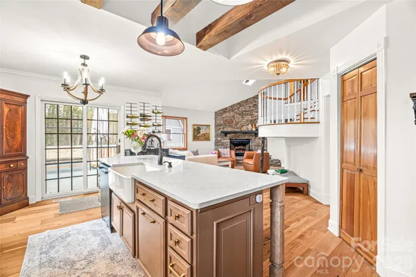 a living room with fireplace furniture and a flat screen tv