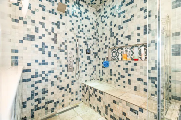 a bathroom with a shower curtain and a sink