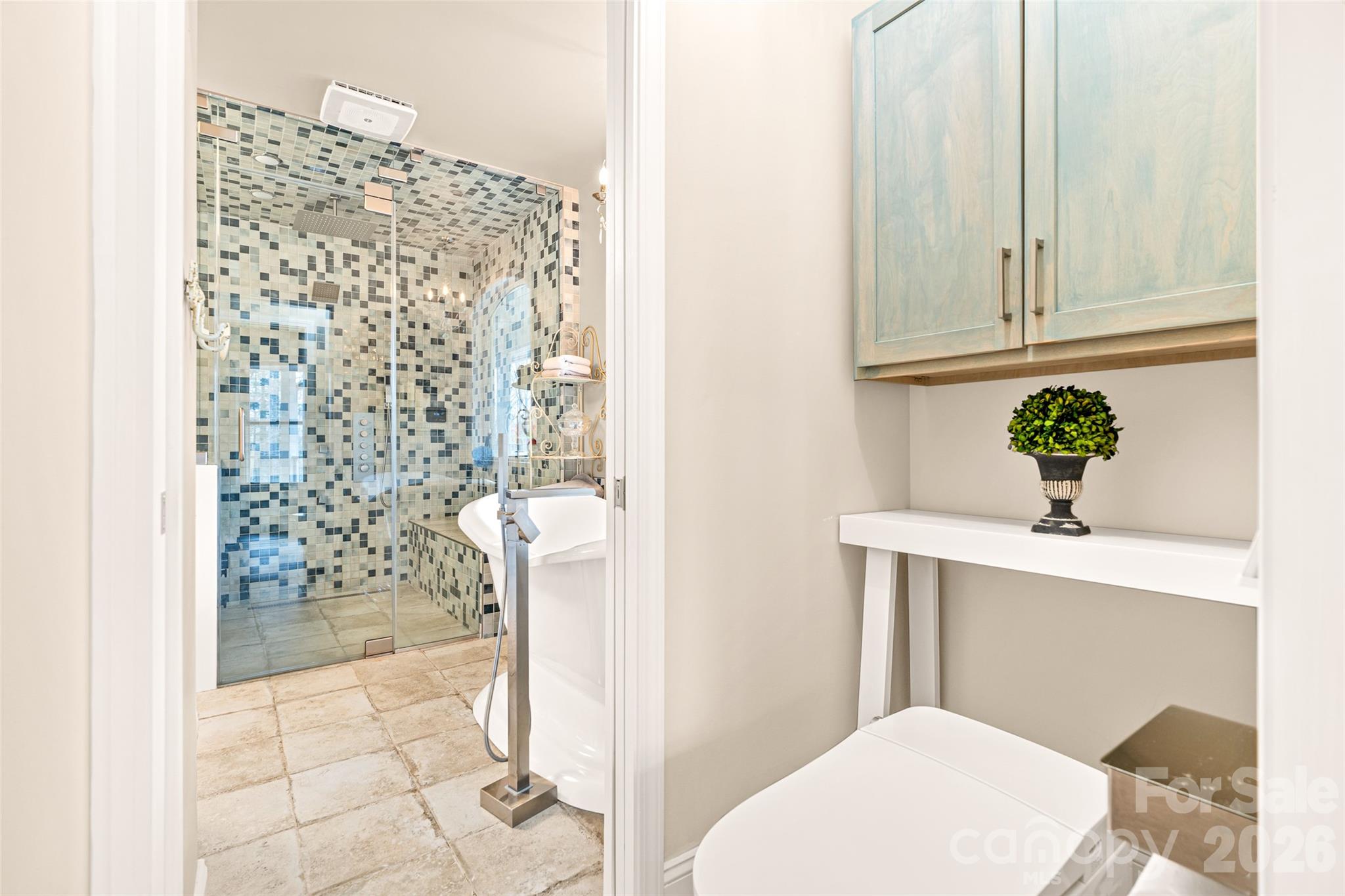 649 Upper Bailey Branch Road Mars Hill, NC 28754 - Photo 25 of 37 a bathroom with a shower curtain and a sink