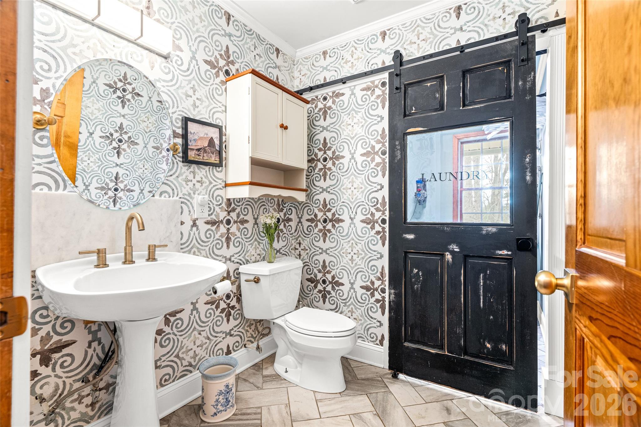 649 Upper Bailey Branch Road Mars Hill, NC 28754 - Photo 26 of 37 a bathroom with a sink a toilet and mirror
