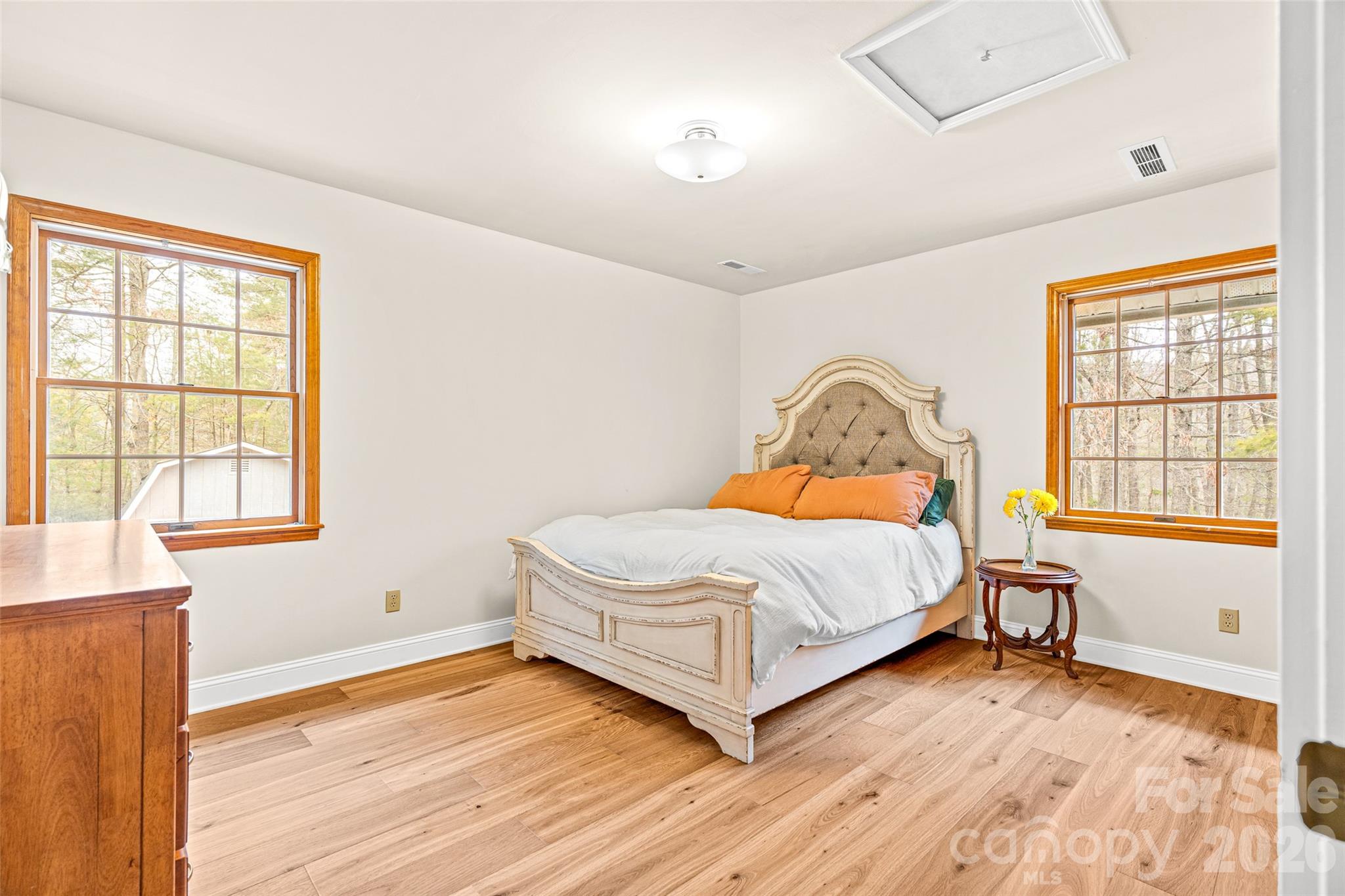 649 Upper Bailey Branch Road Mars Hill, NC 28754 - Photo 28 of 37 a bedroom with a bed and wooden floor