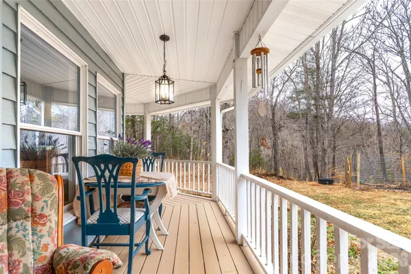 a view of a balcony with chairs