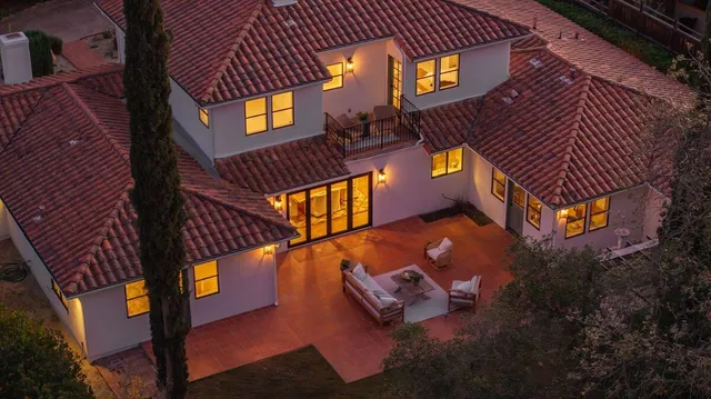an aerial view of a houses with street