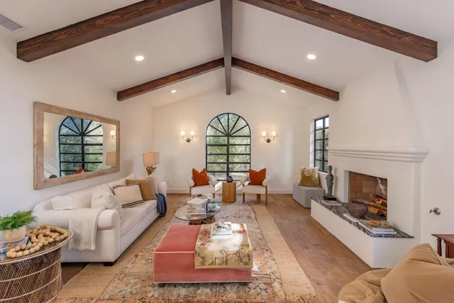 a backyard of a house with table and chairs
