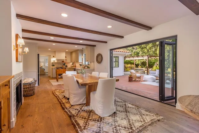 a living room with furniture a rug and a chandelier