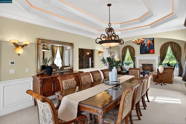 a dining room with furniture and windows