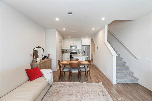 a living room with furniture and a rug