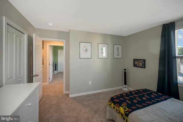 a bedroom with a bed and a cabinets