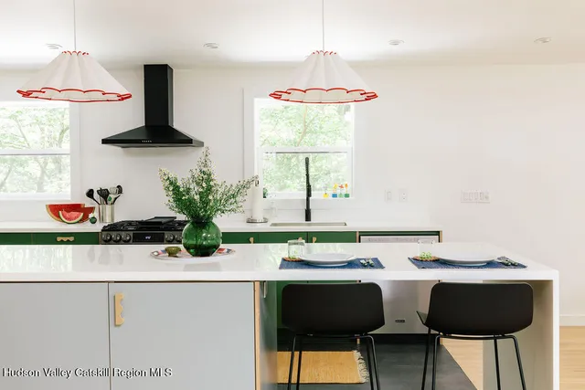 a dining room with furniture and window