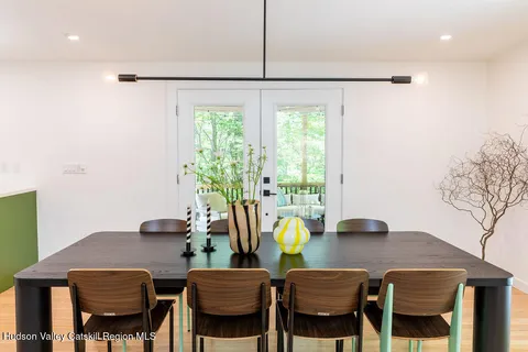 a view of a dining room with furniture and a window