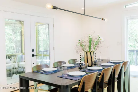 a view of a dining room with furniture window and outside view