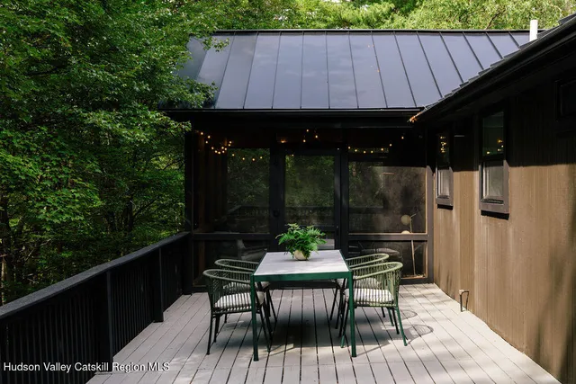 a view of balcony with furniture and potted plants