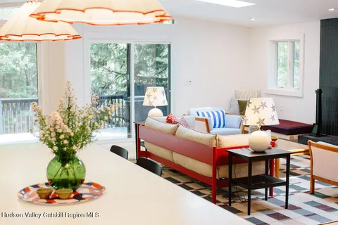 a bedroom with furniture and a potted plant
