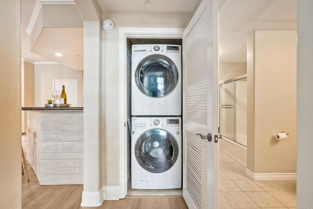 9263 Regents Road La Jolla, CA 92037 - Photo 19 of 37 a view of a hallway with washer and dryer