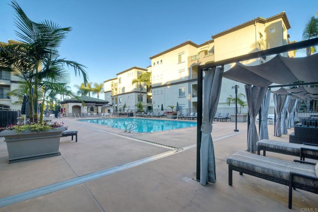 9263 Regents Road La Jolla, CA 92037 - Photo 28 of 37 a swimming pool with outdoor seating and yard