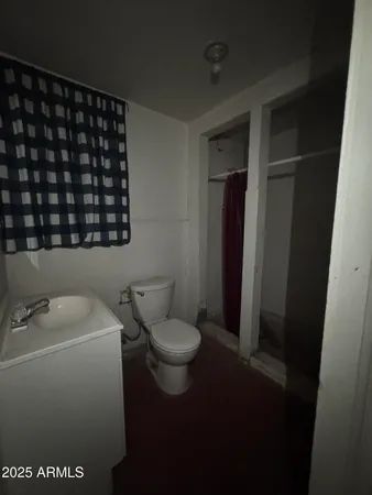 a bathroom with a toilet and a sink