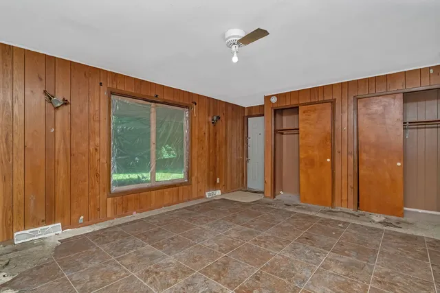 a view of a storage & utility room with a refrigerator