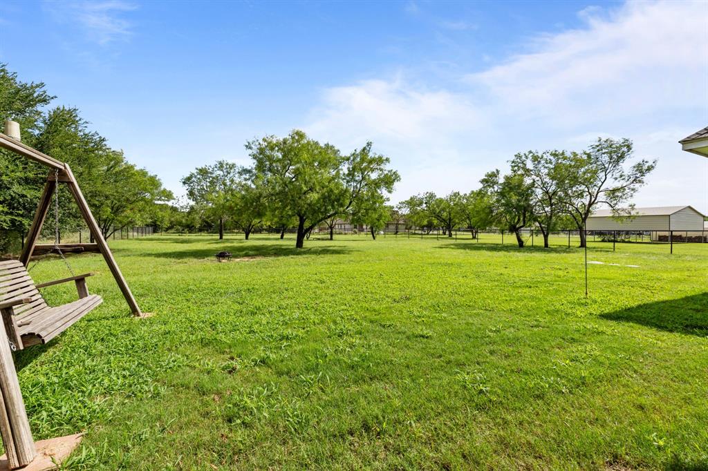 560 Wilson Bend Road Millsap, TX 76066 - Photo 37 of 38 Large, level backyard that is ready for play, pets, shop, pool, etc.!