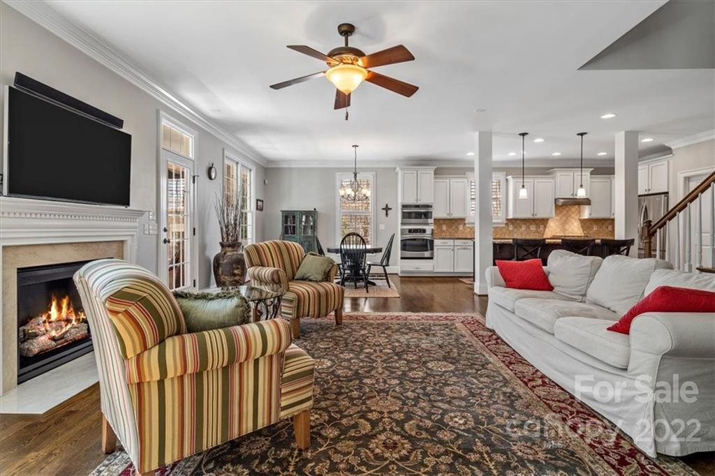 771 Harvest Pointe Drive Fort Mill, SC 29708 - Photo 12 of 48 a living room with furniture kitchen view and a flat screen tv