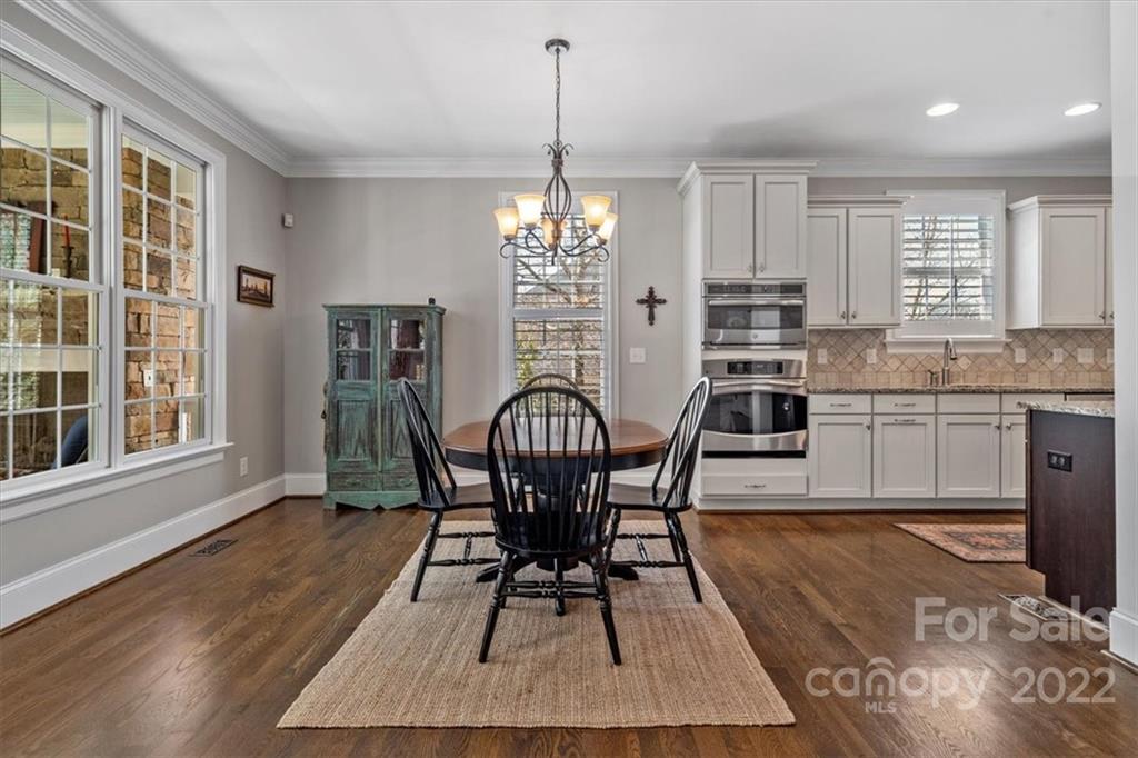 771 Harvest Pointe Drive Fort Mill, SC 29708 - Photo 13 of 48 a view of a dining room with furniture window and wooden floor