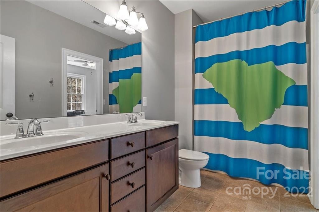 771 Harvest Pointe Drive Fort Mill, SC 29708 - Photo 28 of 48 a bathroom with a sink and a mirror