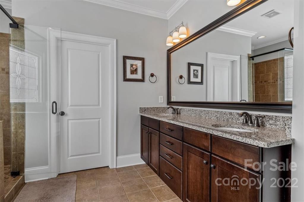 771 Harvest Pointe Drive Fort Mill, SC 29708 - Photo 33 of 48 a bathroom with a granite countertop double vanity sink and a mirror