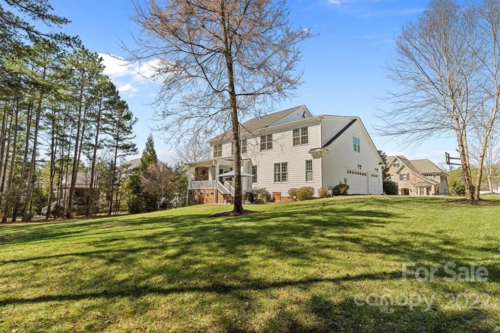 771 Harvest Pointe Drive Fort Mill, SC 29708 - Photo 48 of 48 a view of a white house with a big yard and large trees