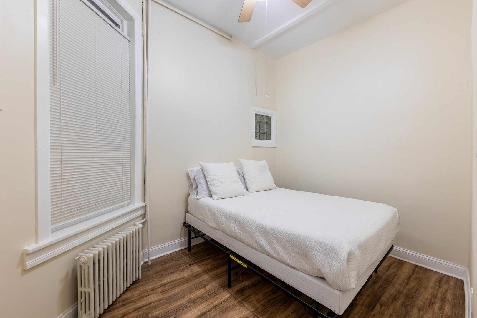 4549 South Wabash Avenue, Unit 1 Chicago, IL 60653 - Photo 16 of 44 a bedroom with a bed and a window