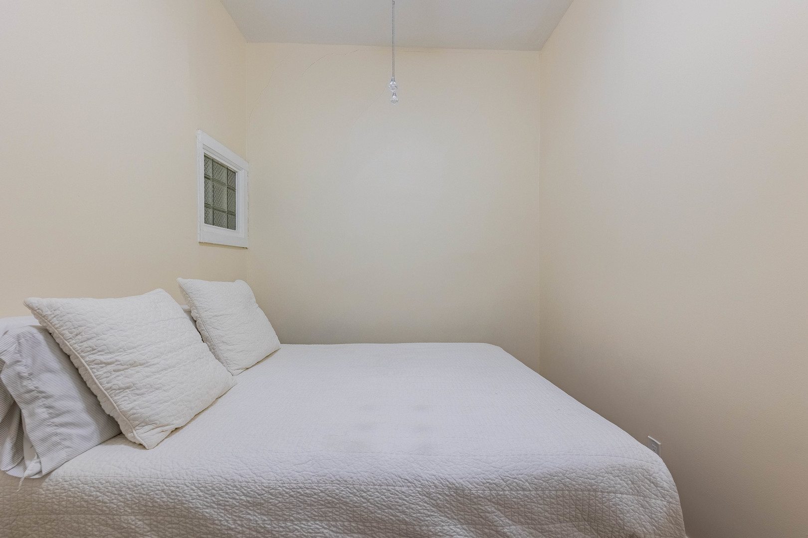 4549 South Wabash Avenue, Unit 1 Chicago, IL 60653 - Photo 17 of 44 a bedroom with a bed and a night stand