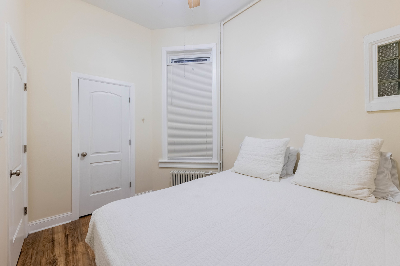 4549 South Wabash Avenue, Unit 1 Chicago, IL 60653 - Photo 18 of 44 a bedroom with a bed and a painting on the wall