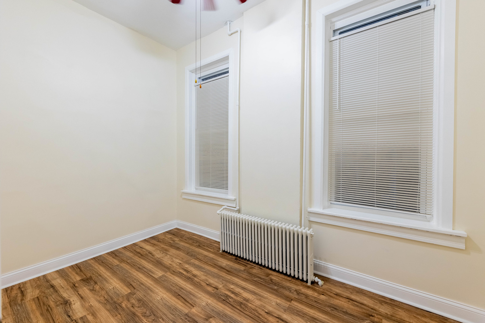 4549 South Wabash Avenue, Unit 1 Chicago, IL 60653 - Photo 24 of 44 a view of a room with wooden floor and windows