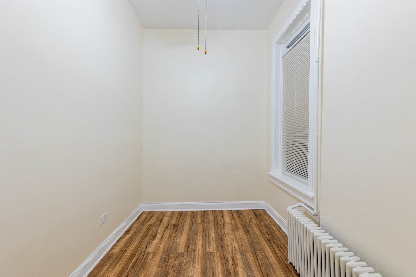 4549 South Wabash Avenue, Unit 1 Chicago, IL 60653 - Photo 25 of 44 a view of a small space with wooden floor and a window