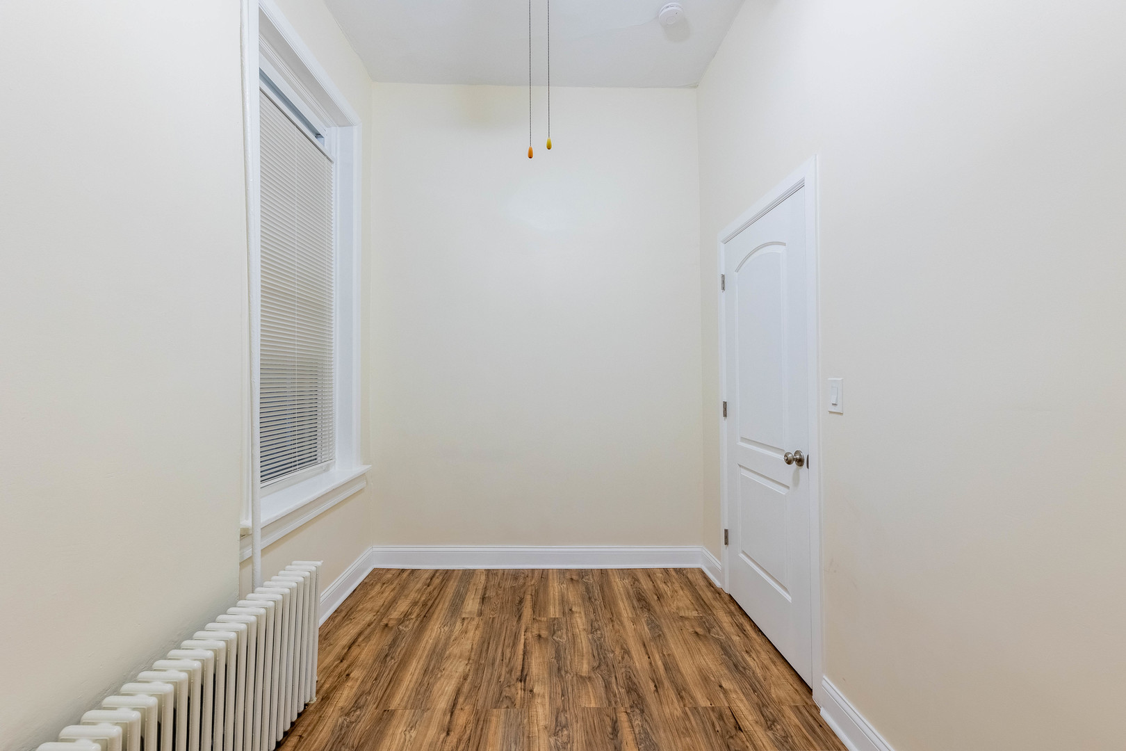 4549 South Wabash Avenue, Unit 1 Chicago, IL 60653 - Photo 26 of 44 a view of a room with wooden floor and small window