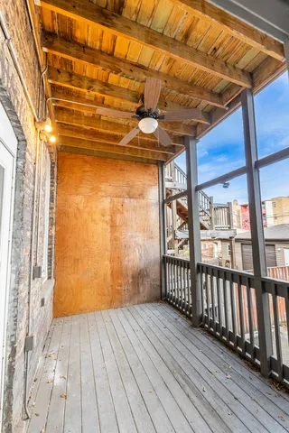 a view of porch with wooden floor