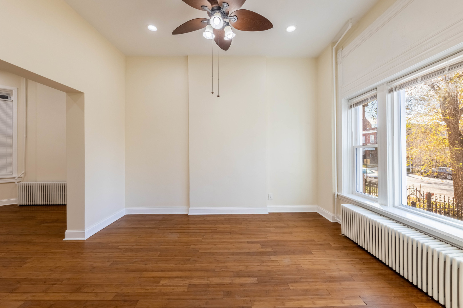 4549 South Wabash Avenue, Unit 1 Chicago, IL 60653 - Photo 5 of 44 wooden floor in an empty room with a window