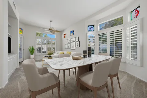 a view of a dining room with furniture window and outside view