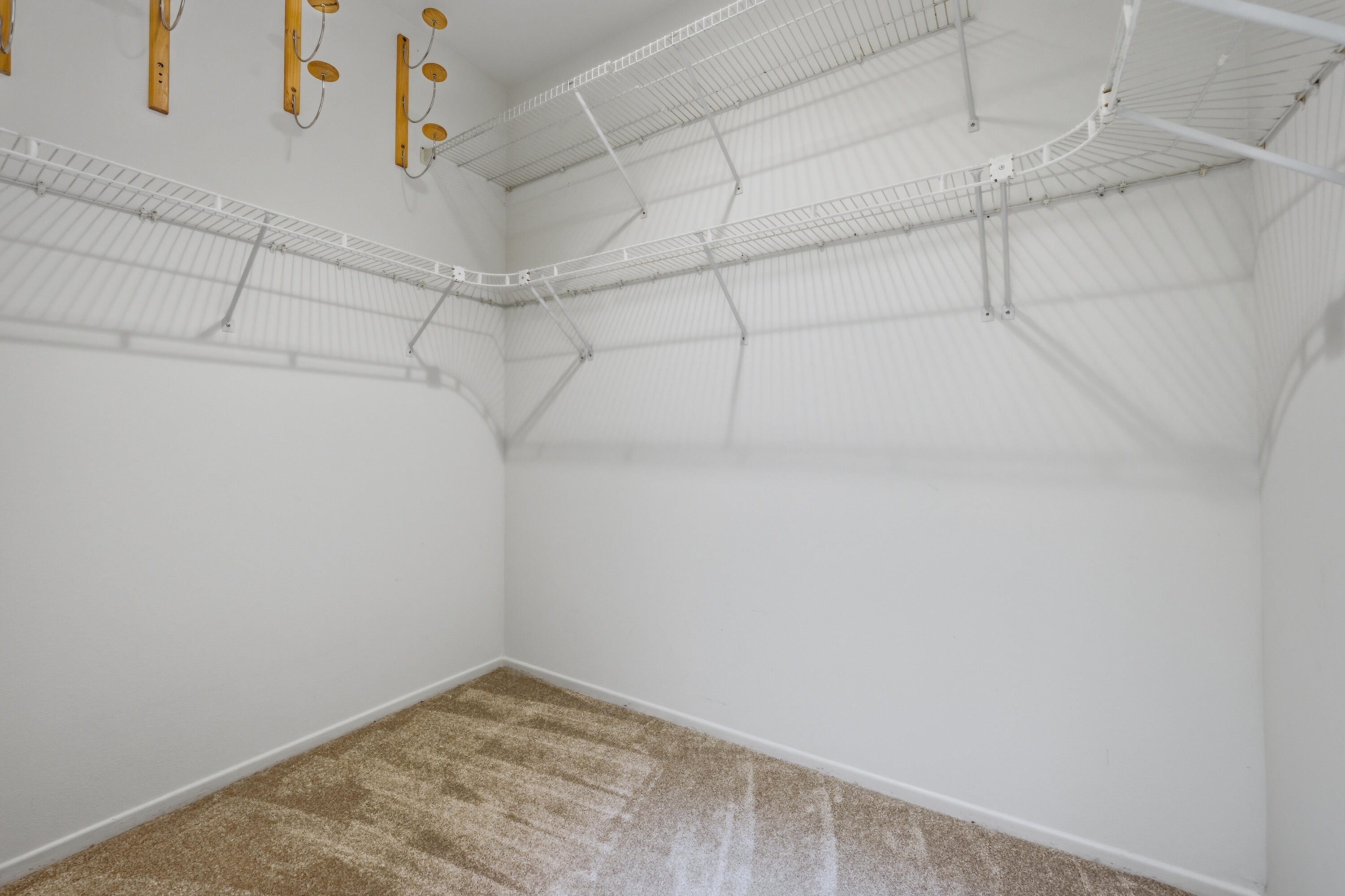 78764 Putting Green Drive Palm Desert, CA 92211 - Photo 19 of 23 a view of a room with racks on the wall