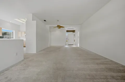 a view of a livingroom with wooden cabinets